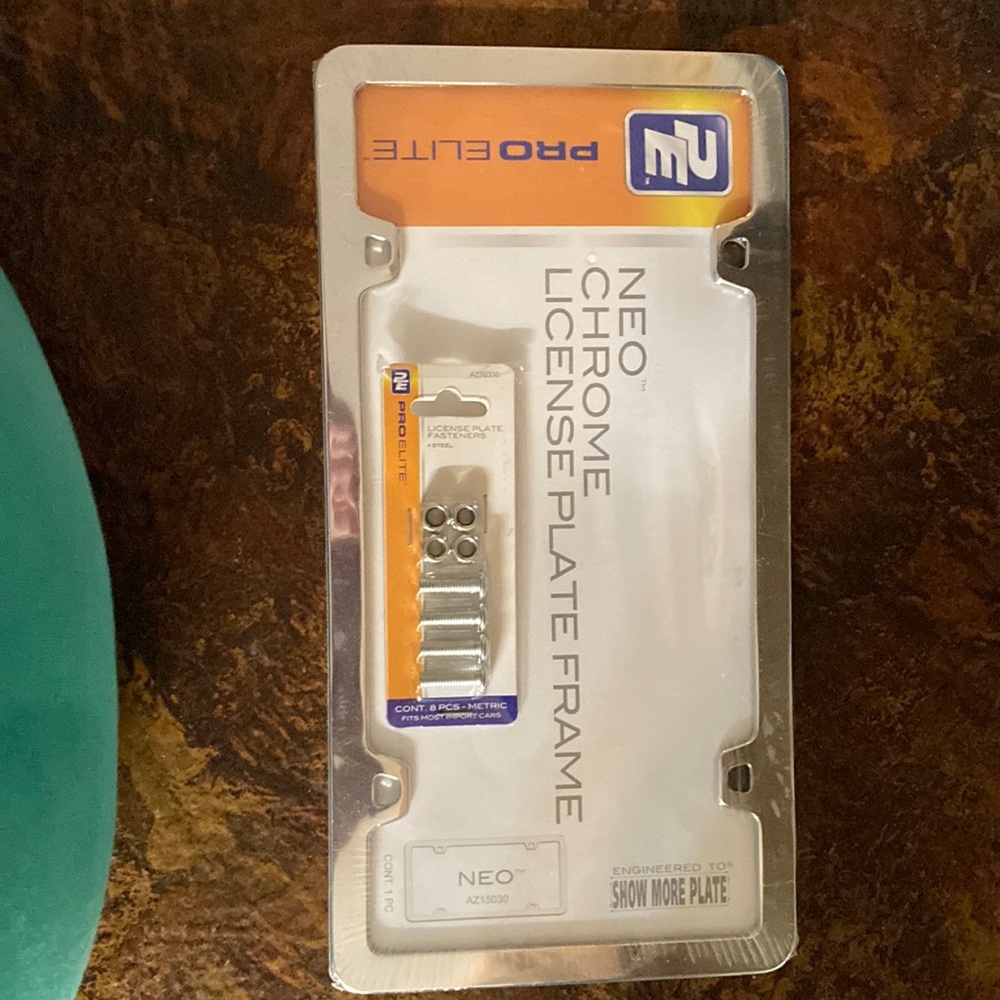 Chrome license plate frame and 4 support screws